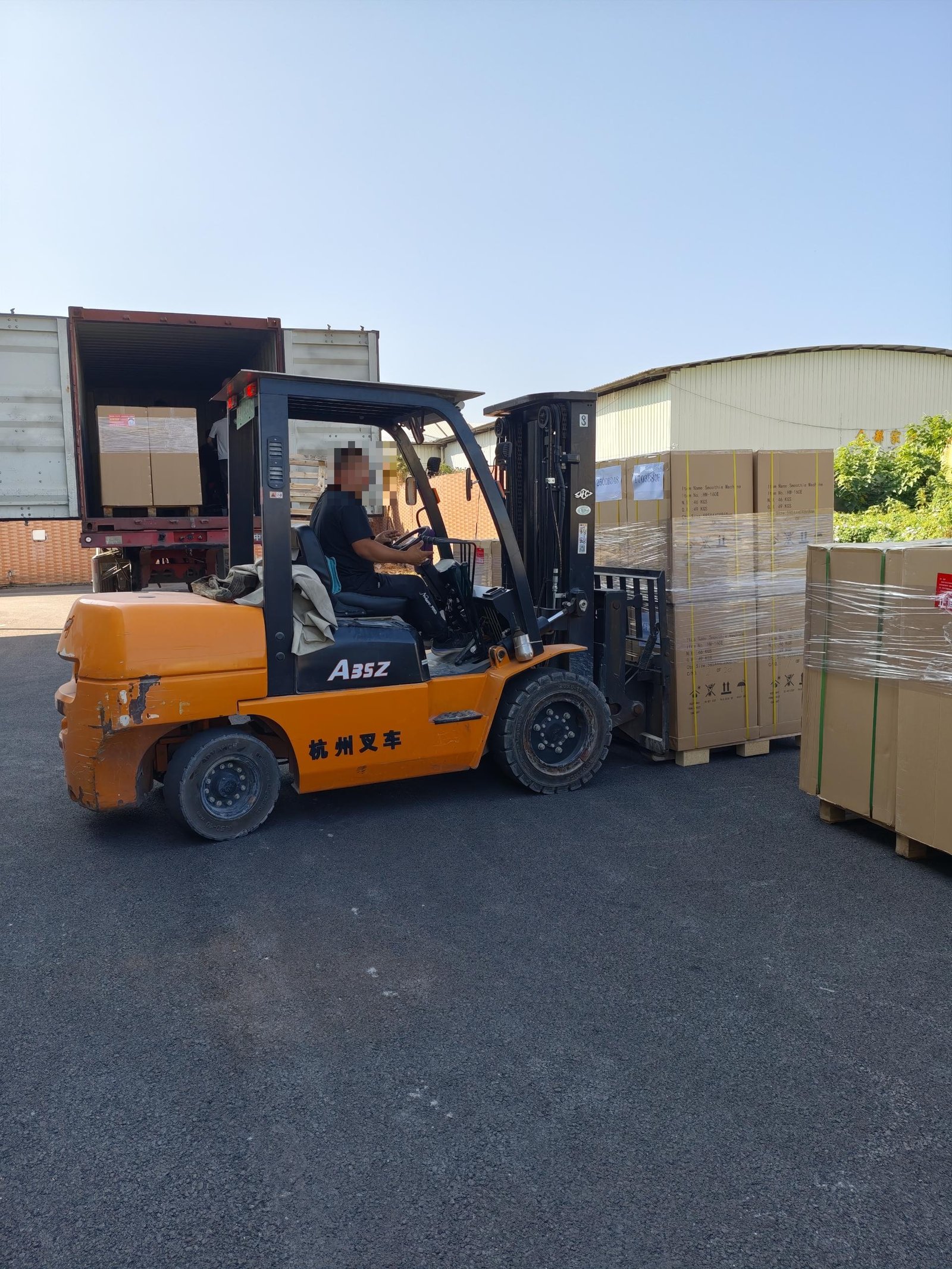 Forklift alongside cartons